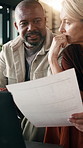 Laptop, interracial couple and financial document in house, mortgage planning and savings review. Budget, mature man and woman in apartment with tech, expenses and discussion with tax paperwork