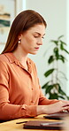 Typing, online and woman with laptop in office, serious and planning for case with digital evidence. Corporate, legal assistant and person with technology, information and trial research in law firm