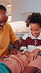 Family, laughing and tickling child in home with happiness, bonding or games together for connection. African people, father and children with playful energy in house, love and humor for relationship