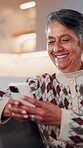Relax, phone and laugh with old woman on sofa in home for bingo app, social media or chat. Funny joke, gaming subscription and virtual dealer with senior person in living room for connection 