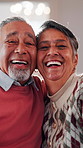 Face, senior and happy couple with hug in home for love, comfort or commitment in retirement. Portrait, elderly man and woman with smile, embrace or care for pension, holiday or weekend in house