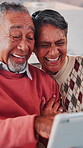 Senior, couple and laugh with tablet in home for funny video, comic online post or bonding together. Love, people or happy with app in house for social media meme, internet joke or retirement support