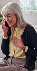 Phone call, chest pain and senior woman in home for healthcare, consultation and explain symptoms. Pensioner, discomfort and tech in living room for doctor appointment, feedback or medical assistance