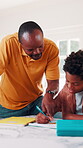 Father, child and help in home with homework, education assignment and smile for understanding. African family, dad and son at table for learning, pointing and teaching with support for development