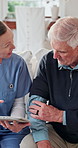 Nurse, old man and tablet for healthcare with consulting, feedback or report in retirement home. App, feedback and medical results with caregiver speaking to senior patient for checkup or visit