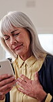 Chest pain, mobile or old woman in home for telehealth, research symptoms or emergency contact. Senior person, stress or phone in house for typing urgent message, heart attack or difficulty breathing