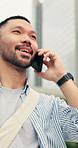 Phone call, happy and man in city with communication, update or feedback on web development. Smile, commuting and Asian software engineer on mobile discussion for review on project in urban town.