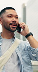 Phone call, walking and man in city with communication, update or feedback on web development. Smile, commuting and Asian software engineer on mobile discussion for review on project in urban town.