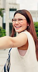 Holding hands, POV and face of woman in city with exploring, sightseeing or travel on holiday. Happy, love and portrait of Asian person with bonding on vacation, weekend trip or getaway together.