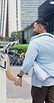 Holding hands, happy and back of couple in city for exploring, bonding and sightseeing on holiday. Running, connection and Asian man with woman for adventure together in urban town for vacation.