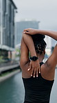 Fitness, stretching and black woman with arms in city for workout preparation or outdoor exercise. Back view, active or female person getting ready with body warm up for training in an urban town