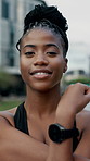 Face, fitness or black woman stretching in city for workout preparation or outdoor exercise. Portrait, active or happy female person getting ready with smile or arm warm up for training in urban town