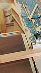 Sliding, table and saw with wood for carpentry, cutting timber and woodworking for production. Person, machine or plank in workshop for joinery, lumber process or trimming for manufacturing furniture