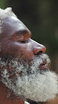 Hiking, thinking and black man with breathing, trip and fresh air with vacation reflection or view. Mature person, outdoor and hiker with weekend break, nature and countryside for explore and holiday