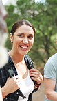 Talking, group and woman in forest for hiking, backpacking and walking for tourism, trip and travel. Friends, outdoor and happy people on nature trail for fitness, exercise and trekking for fresh air