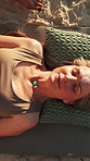 Meditation, crystals and woman on beach for relax, chakra balance or calm for holistic session. Stones, outdoor and mature person with spiritual healing for health, wellness or peace from above.