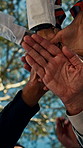 Business, people or hands together in park for teamwork, collaboration or mission in unity. Low angle, group or employees piling with stack, trust or support for social cohesion, inclusion or synergy