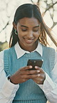 Business, texting and happy woman with phone in city for communication or social media app. Female person, employee or user typing with smile on smartphone for mobile chatting or network connection