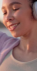 Headphones, dancing and woman by beach on holiday with music, playlist or radio outdoor. Happy, audio tech and person listening to song on album at ocean disco on vacation, getaway or weekend trip.