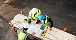 Above, carpentry and blueprint with men in warehouse together for discussion or meeting. Planning, document and teamwork with people in woodworking  workshop for manufacturing partnership or contract