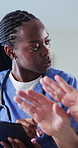 Tablet, consulting and caregiver with senior person for help, checkup and medical results in home. Retirement, nurse and elderly patient on tech for online report, counseling and health assessment
