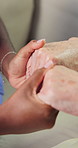 People, nurse and holding hands with patient for understanding, healthcare or empathy in house. Closeup, caregiver or touch with sympathy for emotional support, discussion or comfort in nursing home