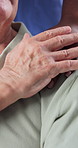 Old man, support and holding hands with nurse in nursing home, trust or connection healthcare worker. Caregiver, help and bonding with senior person, homecare and comfort for patient and elderly care