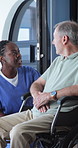 Wheelchair, support and nurse with old man in home for advice, healthcare and hip fracture. Elderly care, medical assistance and multiple sclerosis with senior person with a disability in house