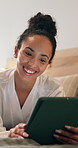 Happy, bed and woman on tablet in hotel for online itinerary,  digital streaming and subscription. Laugh, hospitality and person on tech for internet, research or travel schedule for holiday at night