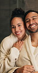 Skincare, smile and happy couple in bathroom of home for morning routine, support and hug. Love, beauty and hygiene with man and woman in house for cosmetics, wellness and self care with dermatology