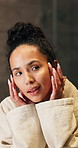 Skincare, happy and woman by mirror in home with cosmetics, health or facial wellness in morning. Beauty, inspection and person checking for acne, marks or pimples on face for dermatology in house.
