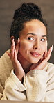 Skincare, face cream and woman by mirror in home with beauty, health or facial wellness in morning. Happy, moisturizer and person with sunscreen or lotion for dermatology routine in apartment.