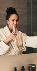 Karaoke, bathroom and woman with hairbrush in mirror for wellness, grooming or fun for morning routine. Dance, reflection and happy person in home for singing, song or energy for self care and health