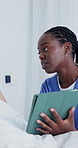 Nurse, tablet or talking with patient in hospital bed for medical checkup or diagnosis. Female person, caregiver or doctor with technology app for breaking news, results or treatment advice in clinic