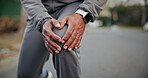 Fitness, hands or man with knee pain in road for muscle spasm, tissue overload or runner injury. Cramp, athlete or tendon discomfort outdoor for cardio accident, kneecap strain or patellar tendinitis