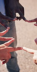 Hands, group and people at park for volunteering, support and solidarity for community service. Huddle, team or star sign in nature with trust, ngo collaboration and synergy for social responsibility