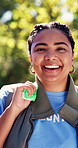 Smile, woman and face of volunteer in nature with trash bag for cleaning community with NGO. Happy, garbage and portrait of charity worker with pride for non profit organization outdoor in park.