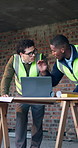 Engineer, team and discussion on construction site with laptop, property development or meeting. Architecture, men and manager in building with digital tech, planning or advice for infrastructure
