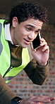 Man, laptop and phone call on construction site for conversation, inspection or update planning. Infrastructure, quality control and engineer with tech, chat or project management for remodeling