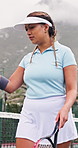 Athlete, woman and ball on court for tennis, fitness and match practice for competition. Female person, player and walking on turf with racket, padel contest and sports training for tournament game