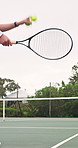 Hands, person and racket on court for tennis, fitness and match practice for competition event. Player, serving and technique on turf with ball, padel contest and sports training for tournament game