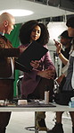 Director, makeup and model in studio with clipboard, catalog and change script for production. Woman, stylist and makeover in bts with document, scene results and review dialogue for filming briefing