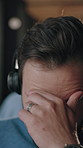 Call center, headache and man in office with headset, frustrated or tired in customer service. Burnout, overwhelmed or person with mic, migraine pressure or workload fatigue in crm management.