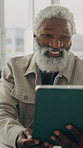 Tablet, reading and happy black man in office for software review, update report and project feedback. Technology, developer and mature person in business for app development, web design and upgrade
