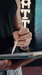 Tattoo, drawing or hands in shop with tablet, online draft or design planning on creative app. Editing, man or artist in studio with pen, digital sketch or body ink development in artistic process.