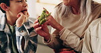 Kids, grandmother and learning with frog in hands, bonding together and development at home. Grandparent, boy and miniature toy in apartment for animal facts, education and talking with family
