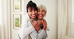 Hug, face and elderly woman in home with caregiver, comfort and wellness in health community. Happy, portrait and senior person with support, retirement and help with compassion or medical service