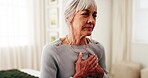 Senior, woman or bed with heart attack in home for cardiac arrest, cramp or chest pain. Elderly, female person or sore ache with virus, disease or chronic stress for pneumonia or illness in house