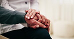 Holding hands, home and old person with caregiver, comfort and wellness in health community. People, closeup and elderly patient with support, retirement or help with compassion or medical service
