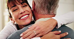 Happy, hug and caregiver with senior man in home for support, comfort or good news on treatment. Smile, healthcare and medical worker embracing elderly patient for trust at consultation in house.